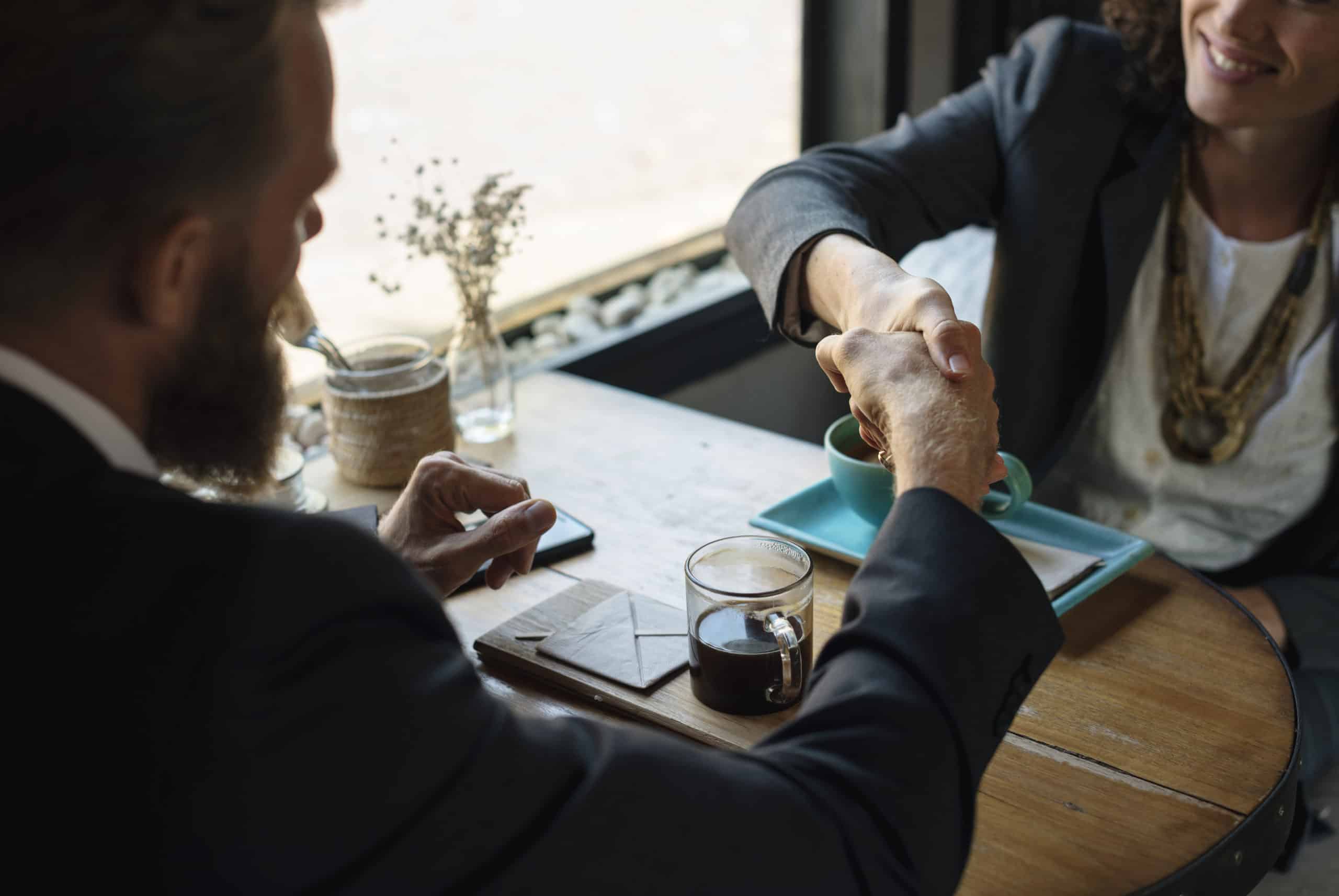 Two business people shaking hands