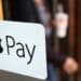 A sign for the launch of the Apple pay system, from Apple.Inc is seen displayed at the entrance to a McDonald's Corp. restaurant in London, U.K. Photographer: Chris Ratcliffe/Bloomberg