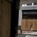 A pedestrian wearing a protective mask walks past a boarded up Wells Fargo & Co. bank branch in Washington, D.C., U.S., on Thursday, June 4, 2020. Photographer: Andrew Harrer/Bloomberg