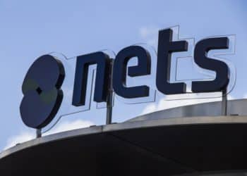 A Nets logo stands above the headquarters of Nets Holding A/S in Copenhagen, Denmark. Photographer: Freya Ingrid Morales/Bloomberg