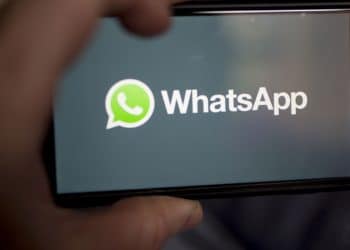 The Facebook Inc. WhatsApp logo is displayed on an Apple Inc. iPhone in an arranged photograph taken in Arlington, Virginia, U.S. on Monday, April 29, 2019. Facebook paid out a $123 million fine to EU antitrust regulators for failing to provide accurate information during their review of Facebook's WhatsApp takeover. Photographer: Andrew Harrer/Bloomberg