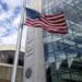 An American flag flies outside the headquarters building of the U.S. Securities and Exchange Commission (SEC) in Washington, D.C., U.S., on Dec. 22, 2018. Parts of the U.S. government shut down on Saturday for the third time this year after a bipartisan spending deal collapsed over President Donald Trump's demands for more money to build a wall along the U.S.-Mexico border. Photographer: Zach Gibson/Bloomberg