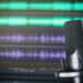 Microphone against background of sound waves