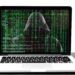 A computer hacker appears on a screen