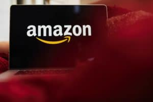 The logo for Amazon.com Inc. is displayed on an Apple Inc. laptop computer in an arranged photograph taken in the Brooklyn borough of New York, U.S., on Friday, April 10, 2020. Across the country, millions of consumers are turning to Amazon.com and other services to fill their fridges via online delivery rather than brave going to a supermarket because of shelter-in-place declarations during the coronavirus pandemic.