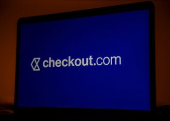 A Checkout.com logo on a laptop computer arranged in London, U.K., on Thursday, Jan. 21, 2021. Payments business Checkout.com has become Europe's largest startup after a fundraising round led by Tiger Global Management that nearly tripled its valuation to $15 billion. Photographer: Hollie Adams/Bloomberg