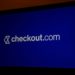 A Checkout.com logo on a laptop computer arranged in London, U.K., on Thursday, Jan. 21, 2021. Payments business Checkout.com has become Europe's largest startup after a fundraising round led by Tiger Global Management that nearly tripled its valuation to $15 billion. Photographer: Hollie Adams/Bloomberg