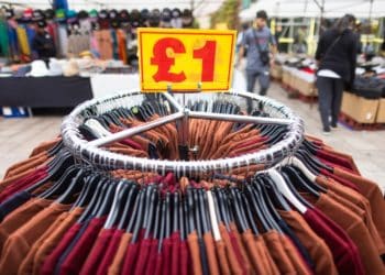 A price sign above a clothing rack on a market stall in Barking, UK, on Tuesday, Sept. 13, 2022. As the UK enters a period of public mourning after the death of Queen Elizabeth II, data releases are likely to show a temporary reprieve in inflation and a jump in wage growth.