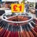 A price sign above a clothing rack on a market stall in Barking, UK, on Tuesday, Sept. 13, 2022. As the UK enters a period of public mourning after the death of Queen Elizabeth II, data releases are likely to show a temporary reprieve in inflation and a jump in wage growth.