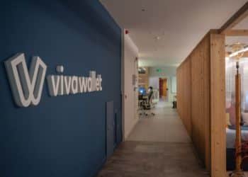 The Viva Wallet logo on a wall in the company offices in Athens, Greece, on Tuesday, April 5, 2022. JPMorgan Chase & Co. is planning to use its recently acquired stake in Greek payments firm Viva Wallet to support lending to small businesses right across European markets, an ambition that would supply a rare cohesion to the continents fragmented banking markets. Photographer: Nick Paleologos/Bloomberg