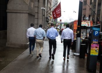 Pedestrians along Wall Street near the New York Stock Exchange (NYSE) in New York, U.S., on Monday, June 27, 2022. Money managers betting on a sustained global rebound will be left sorely disappointed in the second half of this crushing year as a protracted bear market looms, even if inflation cools. Photographer: Michael Nagle/Bloomberg