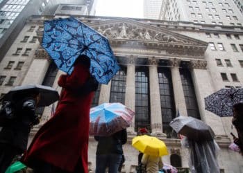 Pedestrians pass in front of the New York Stock Exchange (NYSE) in New York, US, on Tuesday, Jan. 3, 2023. US stocks fell as losses in Apple Inc. and Tesla Inc. weighed on the S&P 500 and the tech-heavy Nasdaq 100. Photographer: Michael Nagle/Bloomberg