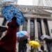 Pedestrians pass in front of the New York Stock Exchange (NYSE) in New York, US, on Tuesday, Jan. 3, 2023. US stocks fell as losses in Apple Inc. and Tesla Inc. weighed on the S&P 500 and the tech-heavy Nasdaq 100. Photographer: Michael Nagle/Bloomberg