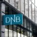 A DNB logo sits on display outside a DNB ASA bank branch in Vilnius, Lithuania, on Monday, Dec. 15, 2014. Lithuania will switch currencies to the euro on Jan. 1, 2015. Photographer: Peter Kollanyi/Bloomberg