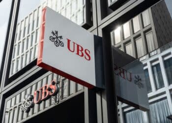 Signage outside a UBS Group AG bank branch in Zurich, Switzerland, on Friday, March 17, 2023. UBS and Credit Suisse Group AG are opposed to a forced combination, even as scenario planning for a government-orchestrated tie-up continues, according to people with knowledge of the matter. Photographer: Francesca Volpi/Bloomberg
