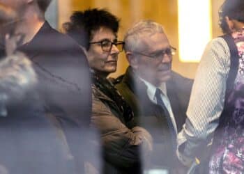 Bankman-Frieds parents, Barbara Fried and Joseph Bankman, center, arrive at court in New York on Thursday for their sons sentencing in his fraud case.