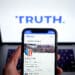 The Truth Social website on a smartphone arranged in New York, US, on Friday, March 22, 2024. Shareholders of Digital World Acquisition Corp., a publicly traded shell company, approved a deal to merge with the Trump's media business in a Friday vote. That means Trump Media & Technology Group, whose flagship product is social networking site Truth Social, will soon begin trading on the Nasdaq stock market, reported the AP. Photographer: Gabby Jones/Bloomberg via Getty Images