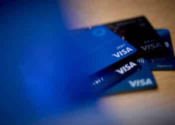 Visa cards arranged in New York, US, on Thursday, Sept. 26, 2024. The US Justice Department sued Visa Inc., alleging the global payments giant illegally monopolized the debit card market, in the Biden administrations first major antitrust case in the financial services industry. Photographer: Gabby Jones/Bloomberg