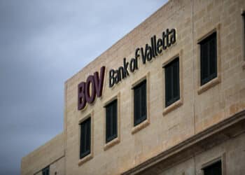 A logo sits on display outside the Bank of Valletta Plc's (BOV) international corporate center in Valletta, Malta, on Tuesday, Oct. 20, 2015. ECB President Mario Draghi will convene his Governing Council on the Mediterranean island of Malta this week to set monetary policy for a 19-nation region that is seeing its recovery buffeted by slowing international trade and global market volatility. Photographer: Yorgos Karahalis/Bloomberg