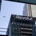 The Revolut Ltd. headquarters in Canary Wharf, London, UK, on Tuesday, Dec. 2, 2025. Measures in the UK budget to attract more companies to the London Stock Exchange will help the bourse compete against the Nasdaq for financial technology listings, the chair of challenger bank Revolut Ltd. said. Photographer: Chris Ratcliffe/Bloomberg