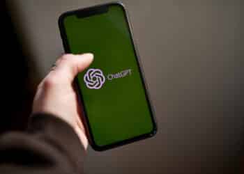 The ChatGPT logo on a smartphone arranged in the Brooklyn borough of New York, US, on Thursday, March 9, 2023. ChatGPT has made writing computer code and cheating on homework easier. Soon, it could make email scams a cinch. That's the warning from Darktrace Plc, the British cybersecurity firm. Photographer: Gabby Jones/Bloomberg