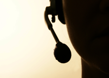 silhouette of a person wearing a call center headset