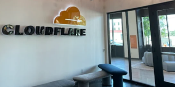 Interior of a Cloudflare office building with signage