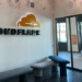 Interior of a Cloudflare office building with signage