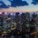 Commercial buildings illuminated at dusk in Singapore