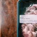 A fraud alert pings on a mobile phone