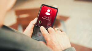 man decides whether or not to accept call identified as fraud