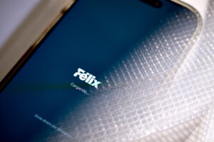 the Felix Pago WhatsApp-based digital app on a mobile phone