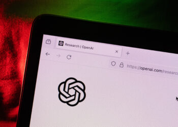 The OpenAI virtual assistant logo on a laptop compute