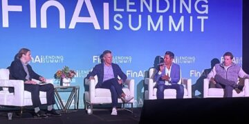 Four panelists on a stage with a large sign reading "FinAi Lending Summit" behind them